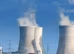 Power plant chimneys belch smoke